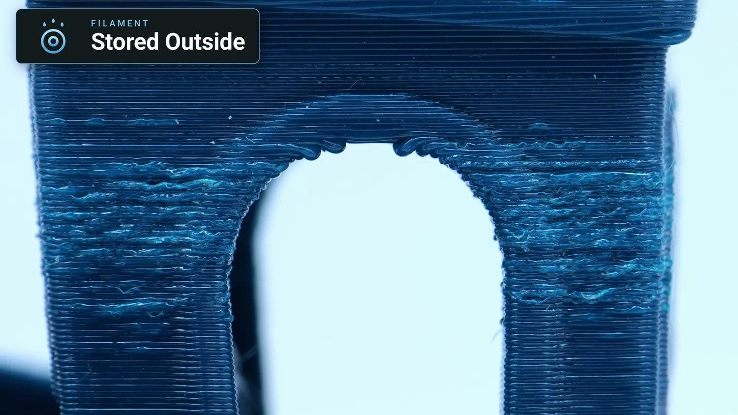 Close-up of the foamy arch of a PETG Benchy printed from filament stored outside
