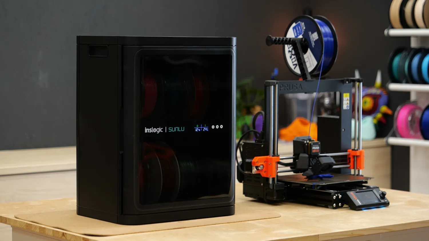 The i10 standing next to a Prusa MK4 printer