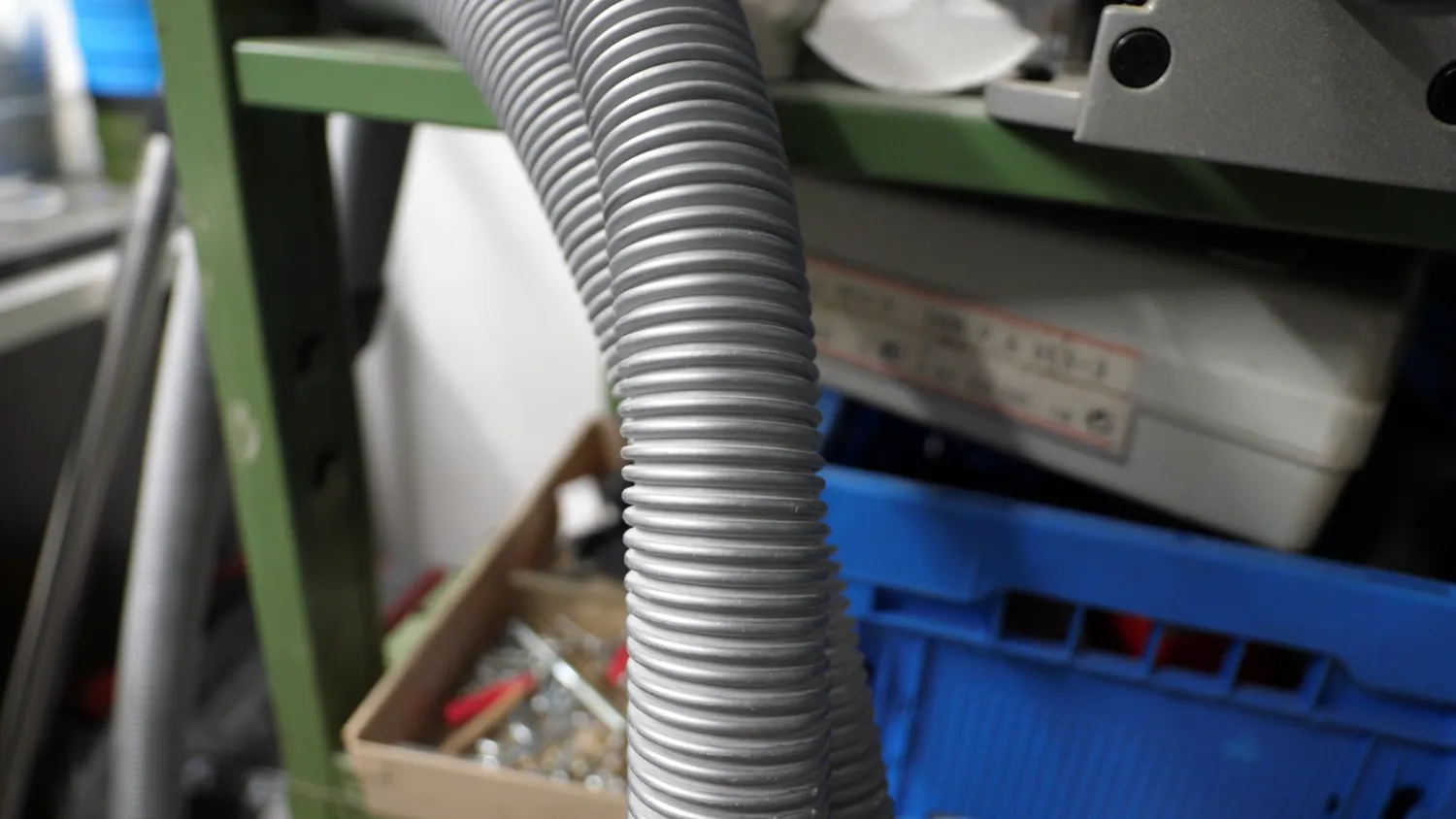 Corrugated flexible hose, stiff across the rings and floppy along them
