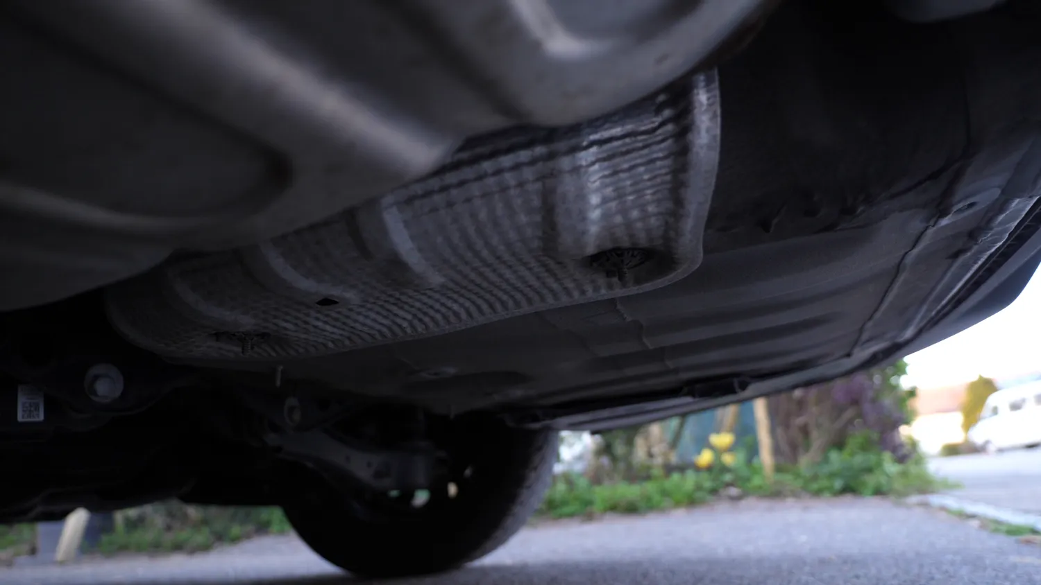 Ribbed underbody panelling beneath a car
