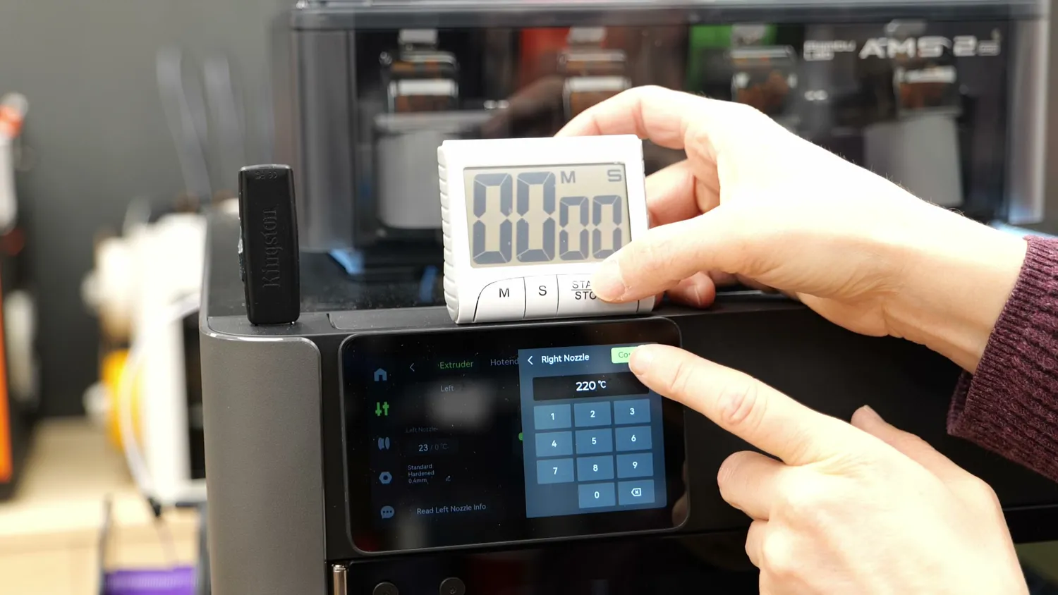 Kitchen timer next to the H2C touchscreen during nozzle heat-up