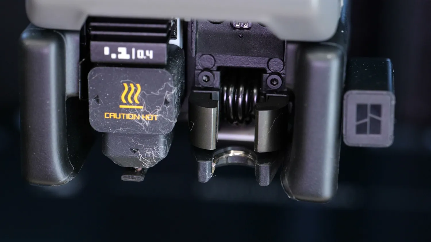 H2C printhead with the C-shaped induction core around the nozzle