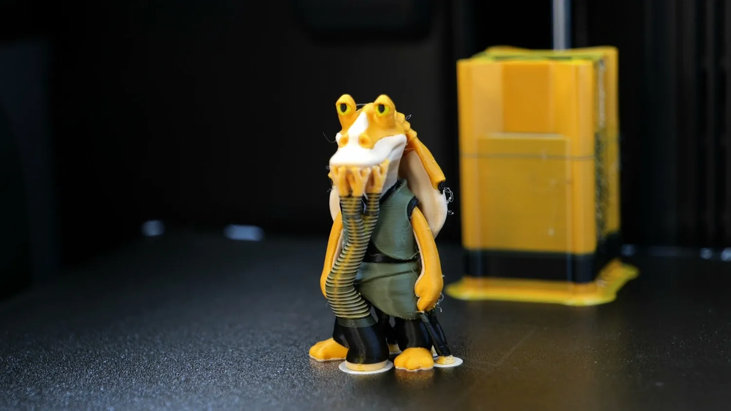 Multi-color figure printed next to its purge tower