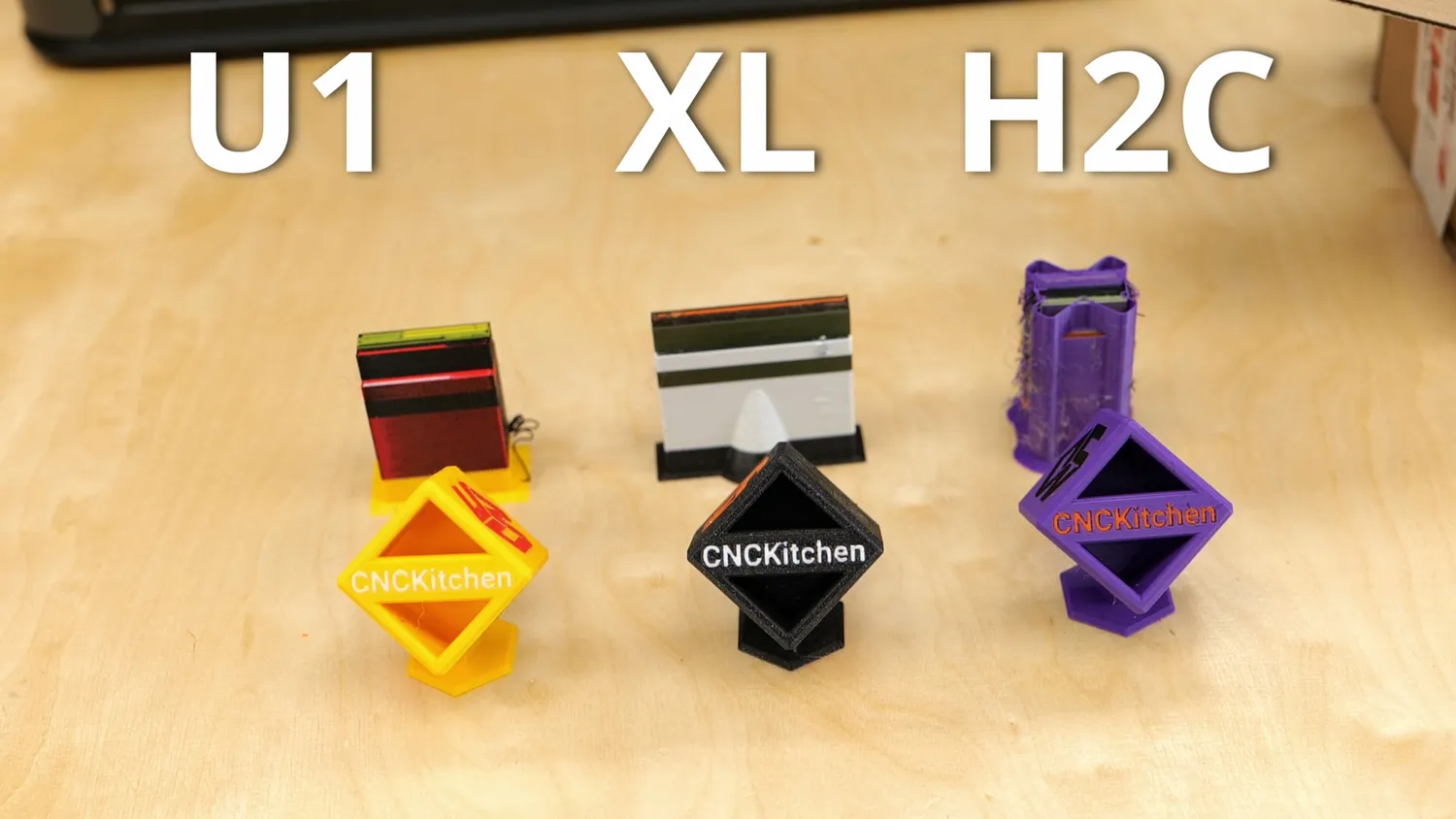 The same test cube printed on the Snapmaker U1, Prusa XL and H2C