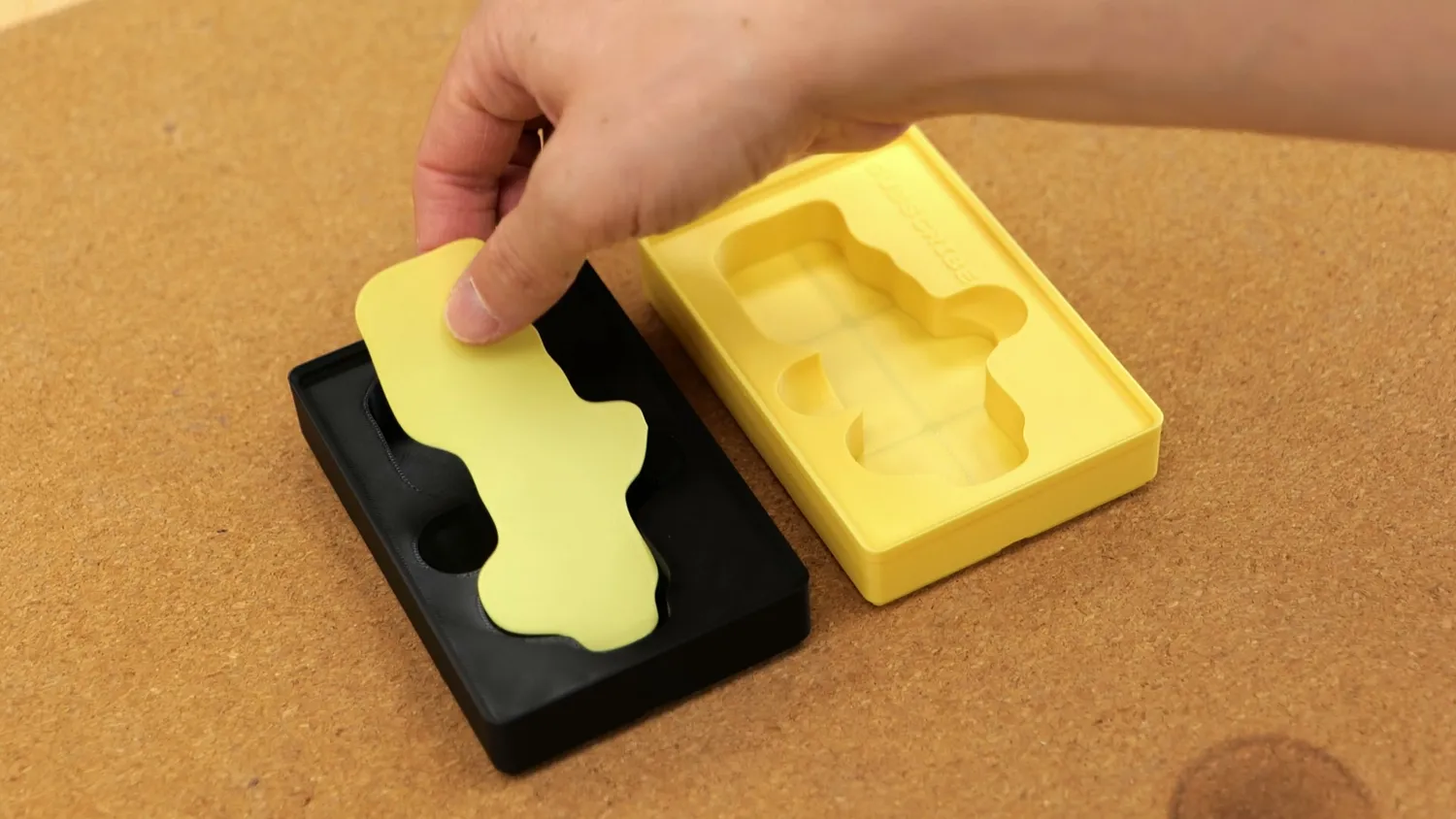 Yellow insert dropped into a separately printed black bin