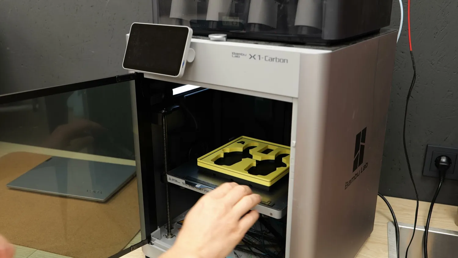 Yellow Gridfinity bins printed on a Bambu Lab X1 Carbon