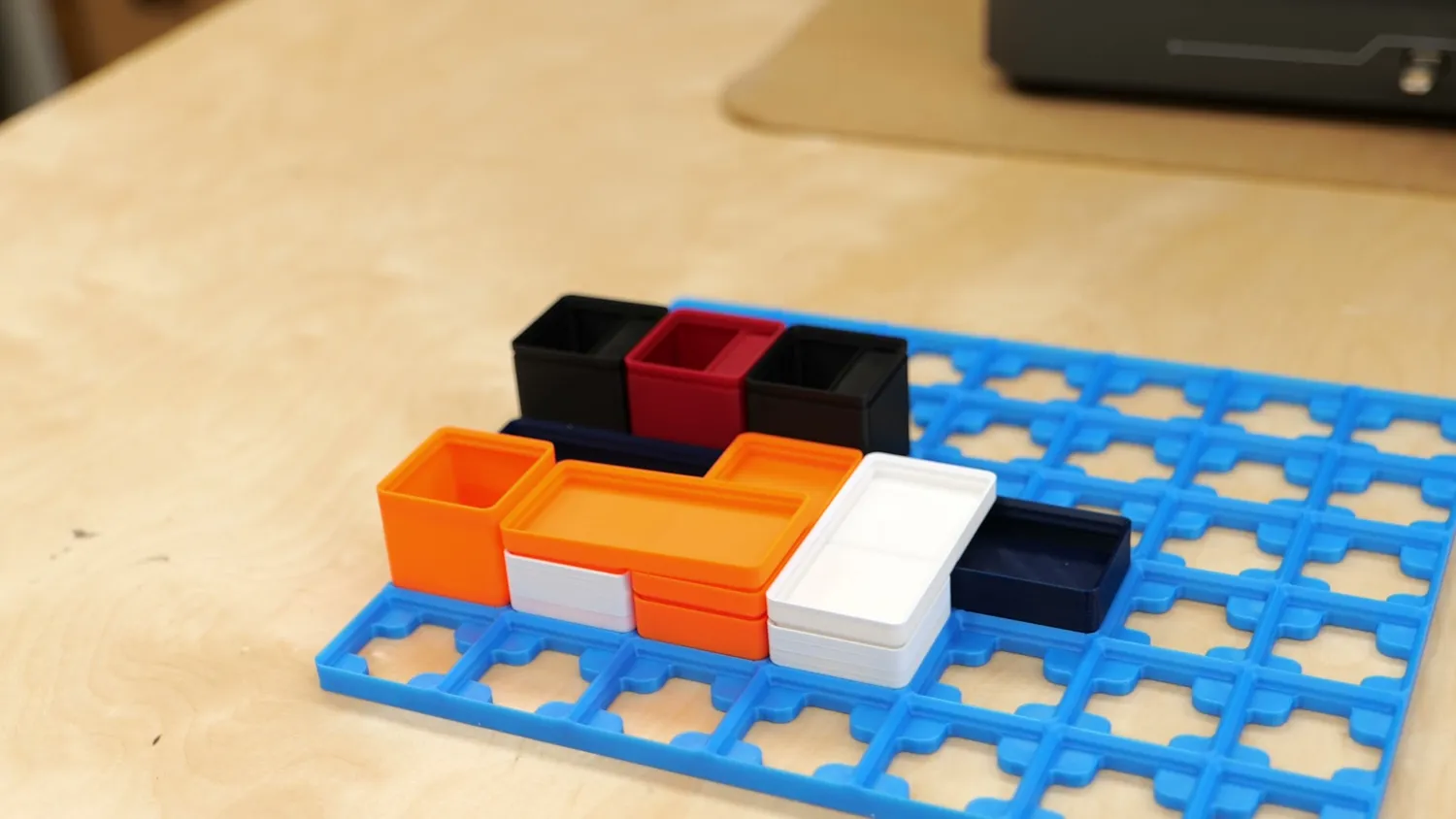 Standard Gridfinity bins on a blue baseplate