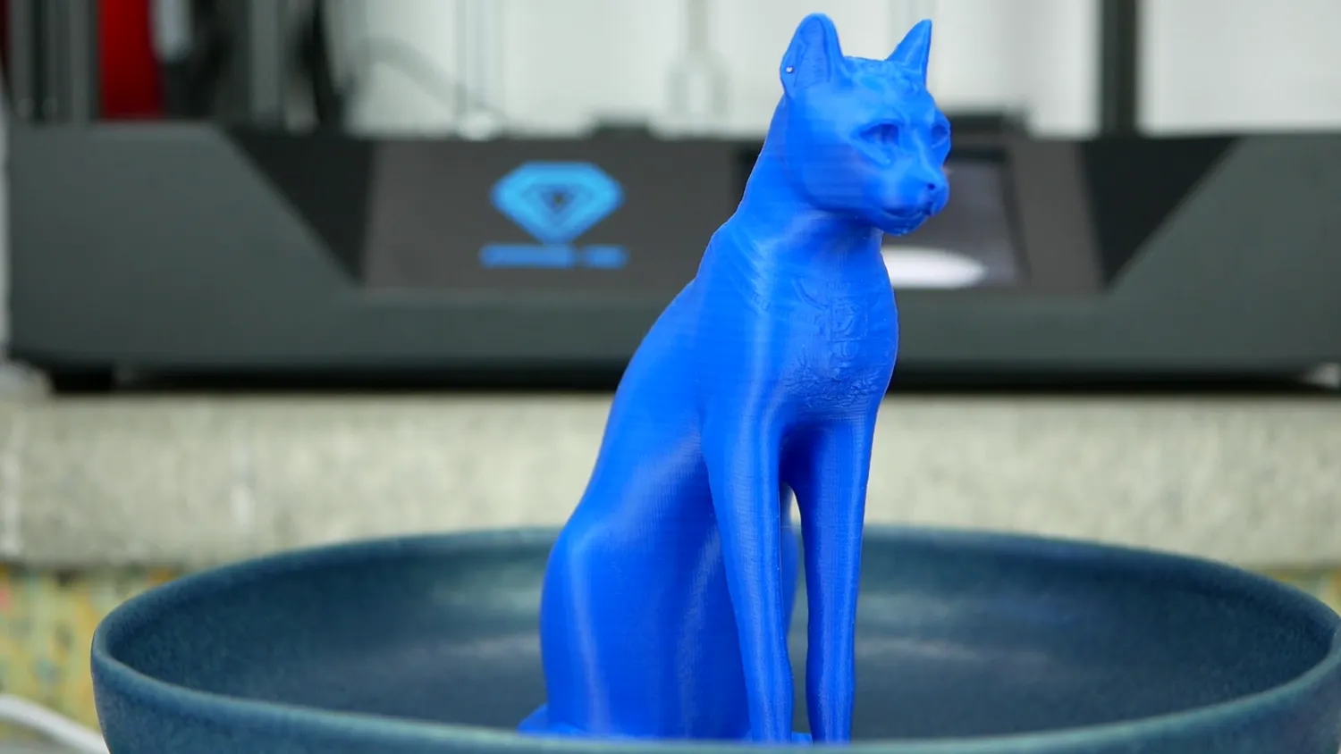 A blue Egyptian cat printed on the Sapphire Pro, the z-wobble showing as faint horizontal bands on the flanks