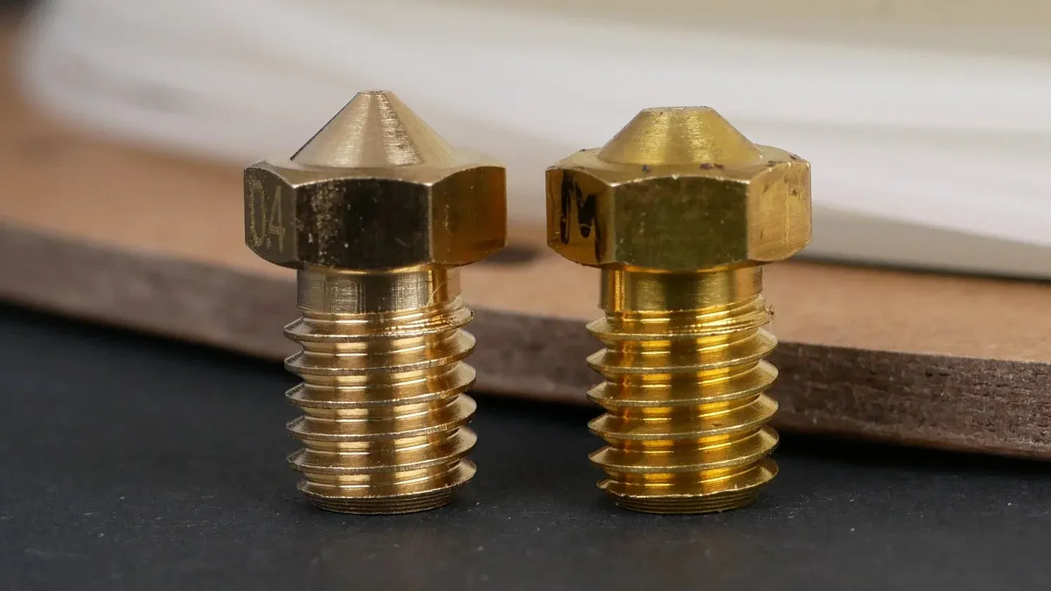  New nozzle (left) and worn down nozzle after 100g glow in the dark filament (right) 