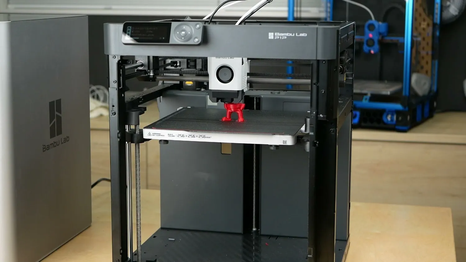 Bambu Lab P1P printing a red part